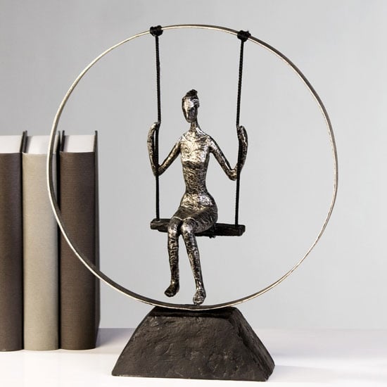 Photo of Swing sculpture in poly metal silver with black base
