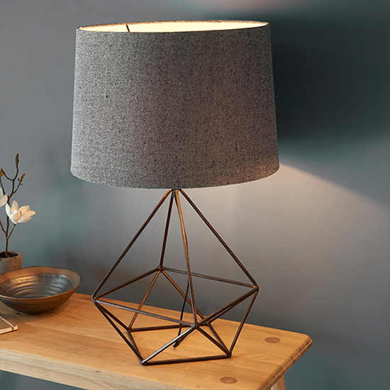 Photo of Apollo grey fabric table lamp in aged copper
