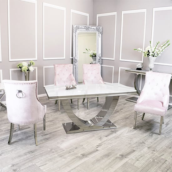 Photo of Avon white glass dining table with 4 dessel pink chairs