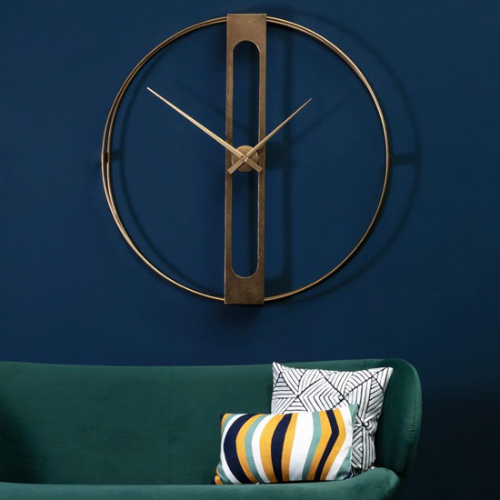 Photo of Bealie round metal wall clock in gold