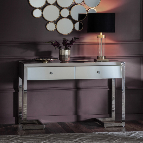 Read more about Cutlier mirrored console table with steel legs in silver