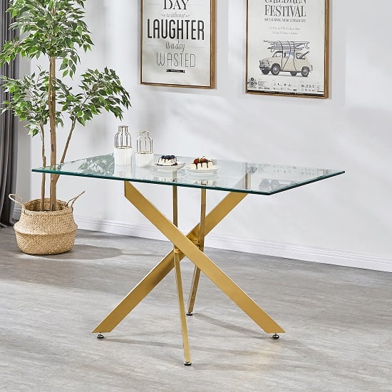 Read more about Daytona small clear glass dining table with brushed gold legs