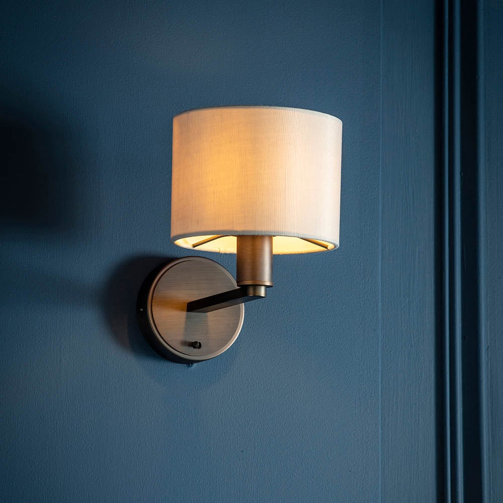 Read more about Deland white fabric shade wall light in bronze