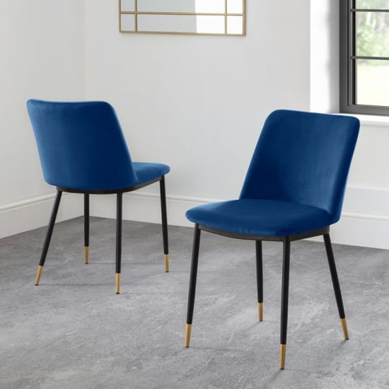 Photo of Daiva blue velvet upholstered dining chairs in pair