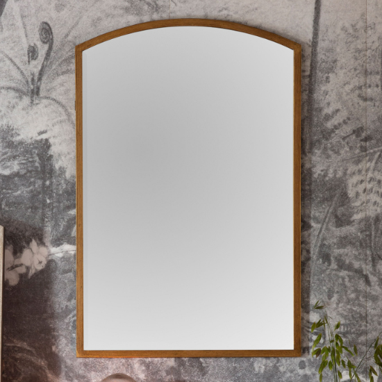 Read more about Haggen small arch bedroom mirror in antique gold frame