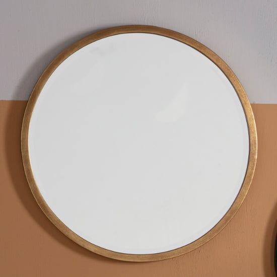 Read more about Haggen small round bedroom mirror in antique gold frame
