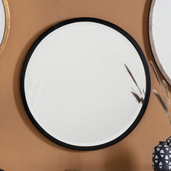 Photo of Haggen small round bedroom mirror in black frame