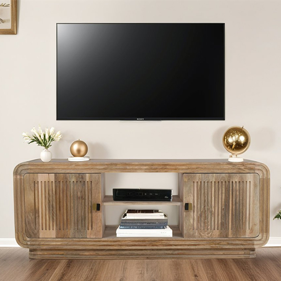 Product photograph of Hailey Carved Mango Wood Tv Stand With 2 Doors In Natural Oak from Furniture in Fashion