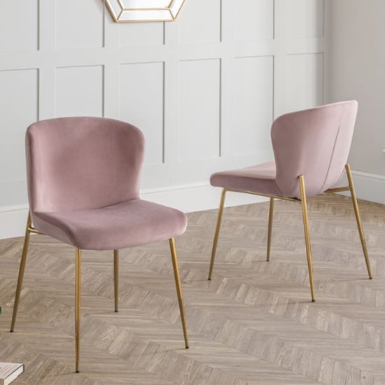 Photo of Haimi pink velvet dining chair with gold metal legs in pair