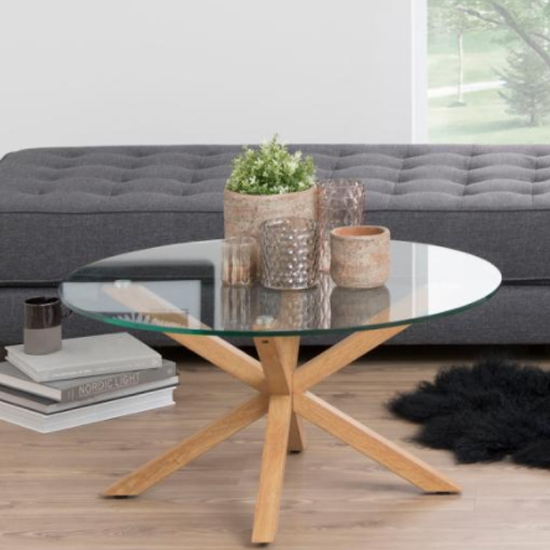 Read more about Herriman round clear glass coffee table with oak legs