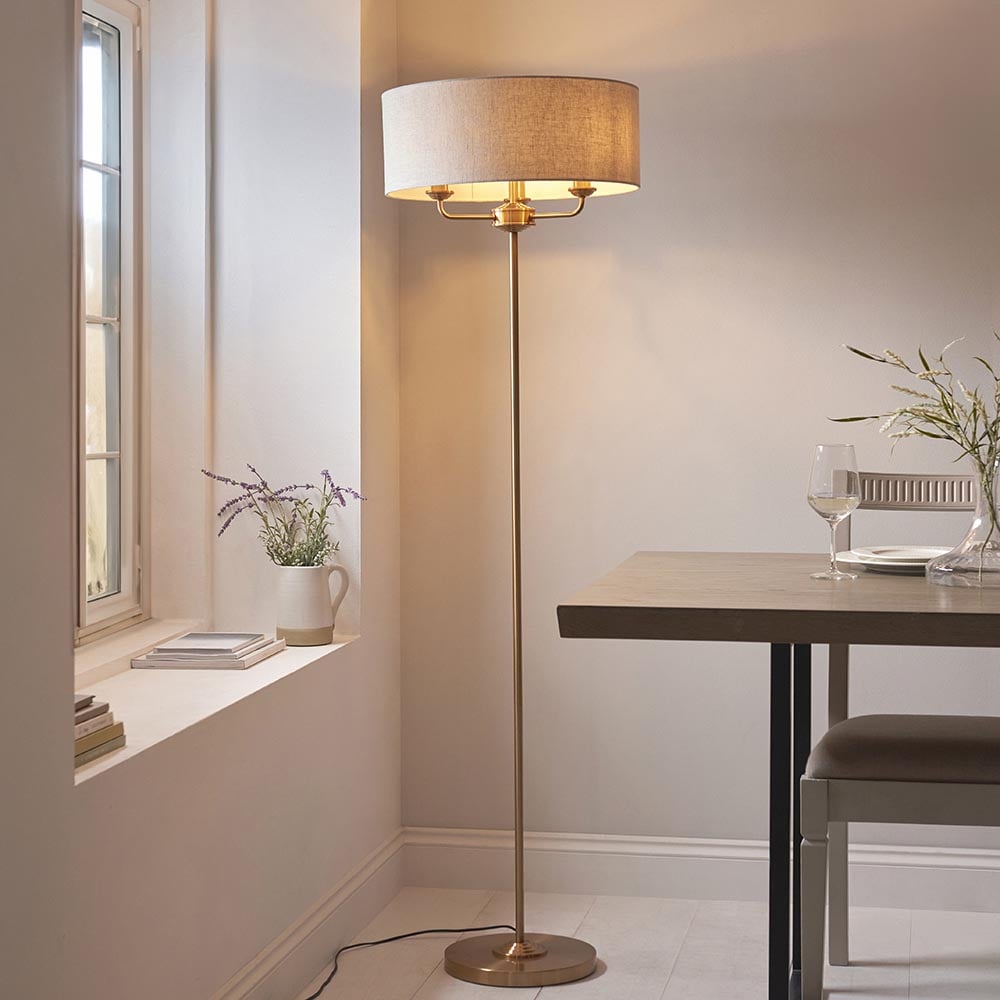 Product photograph of Hixson 3 Light Natural Fabric Floor Lamp In Vintage Brass from Furniture in Fashion