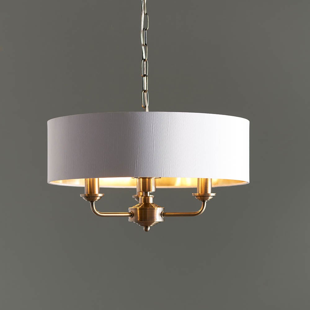 Read more about Hixson 3 light white fabric pendant ceiling light in brass