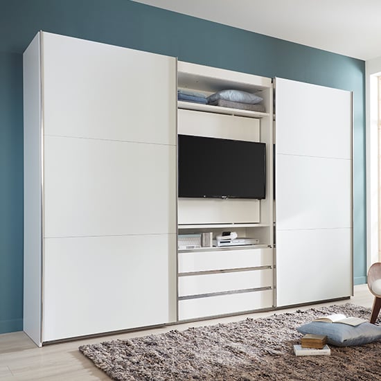 Read more about Magic wooden sliding door wardrobe in white with tv shelf