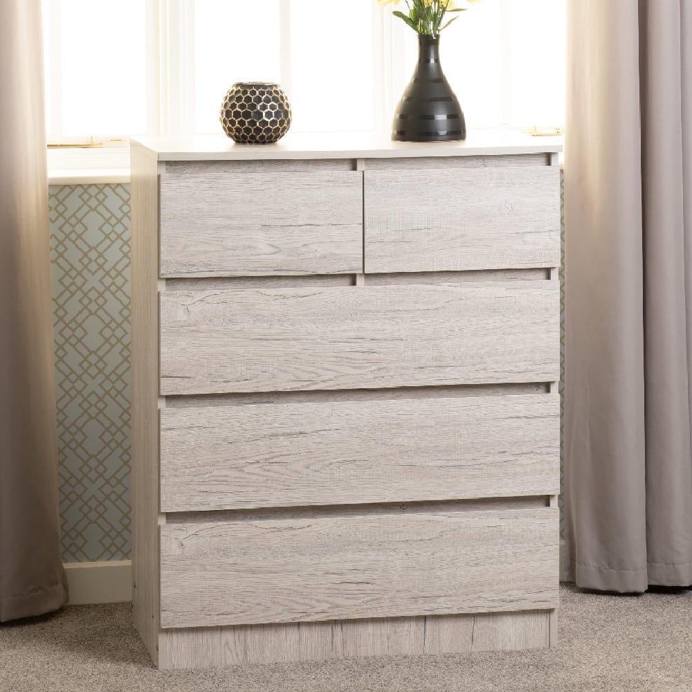 Read more about Mcgowen wooden chest of 5 drawers in urban snow