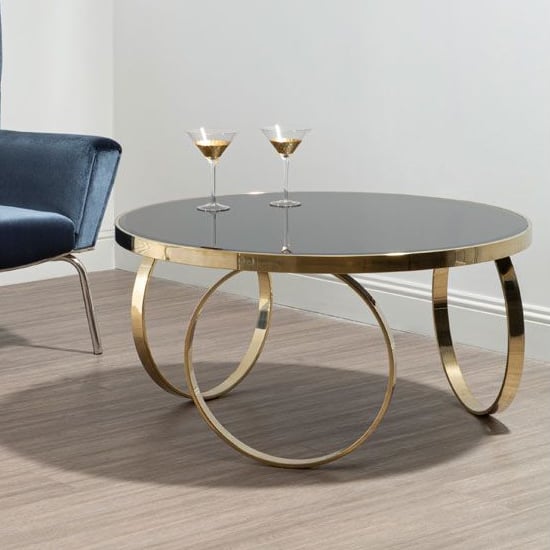 Read more about Meleph 100cm round black glass top coffee table with gold frame