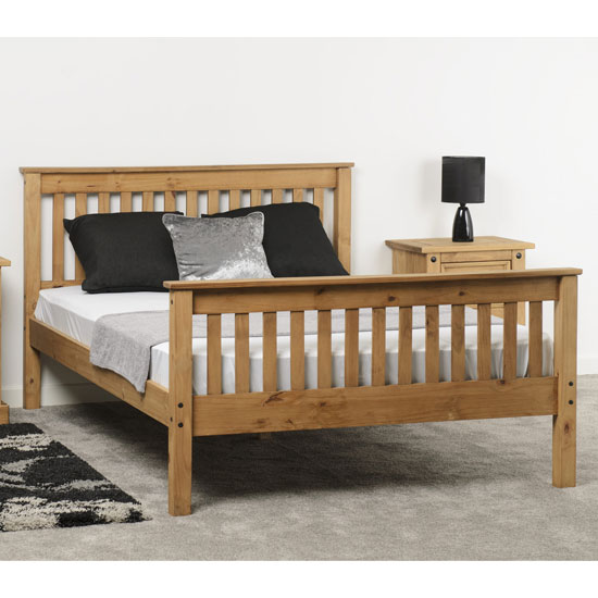 View Merlin wooden high foot end double bed in waxed pine
