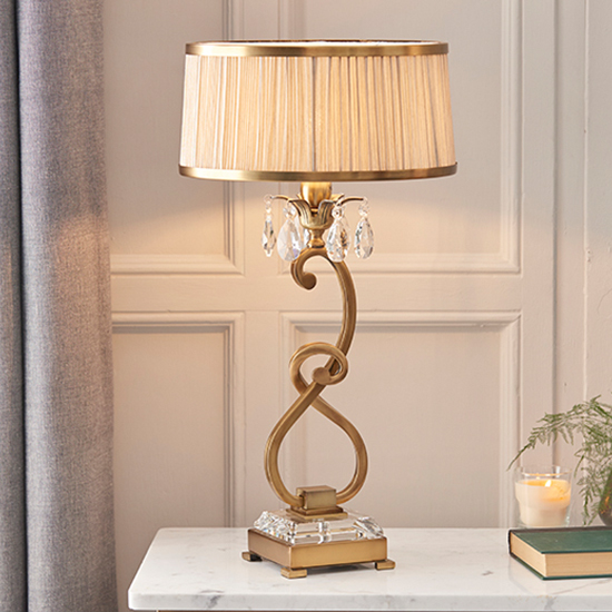 Read more about Oksana medium table lamp in antique brass with beige shade