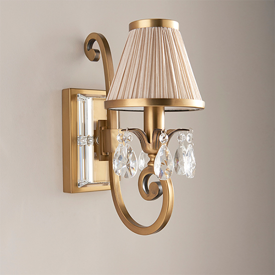 Photo of Oksana single wall light in antique brass with beige shade