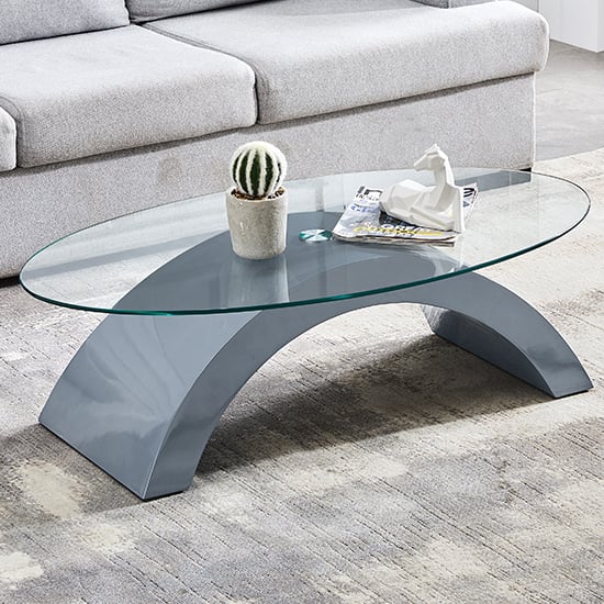 Read more about Opel oval clear glass coffee table with grey high gloss base