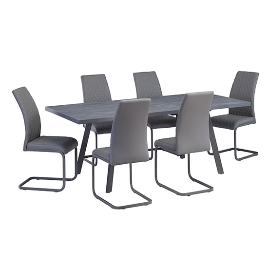 Photo of Paley extending dining table with 6 huskon grey chairs