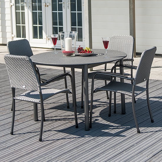 Photo of Prats outdoor stone top dining table with 4 armchairs in grey