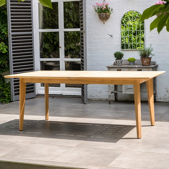 Photo of Robalt outdoor extending wooden dining table in natural