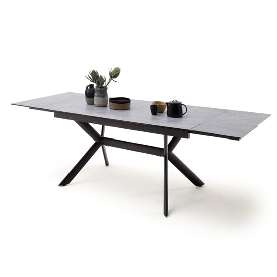 Read more about Siros extending glass dining table in concrete effect