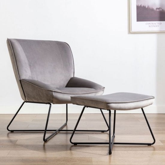 Photo of Teagan velvet upholstered accent chair in grey with footstool