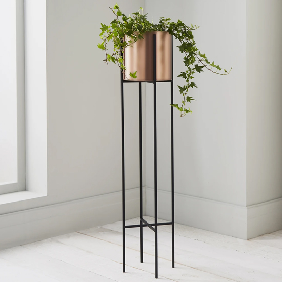 Product photograph of Vail Small Metal Stilts Plant Holder In Black And Copper from Furniture in Fashion