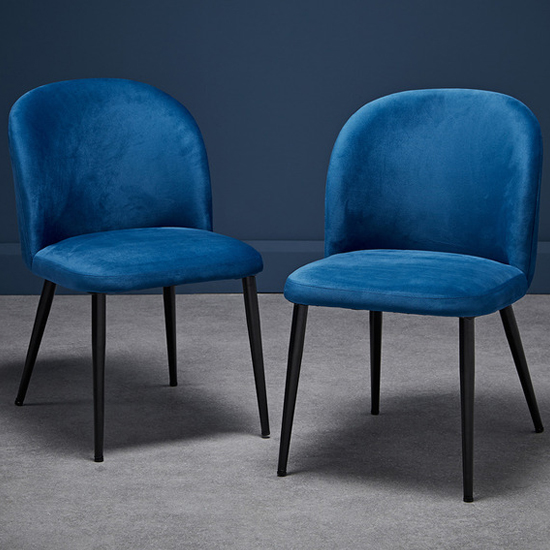 Photo of Zaza blue velvet dining chairs with black legs in pair